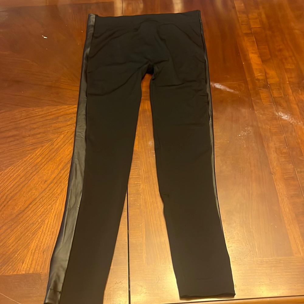 Super cute, black leggings with faux leather border 95% polyester, 5% spandex